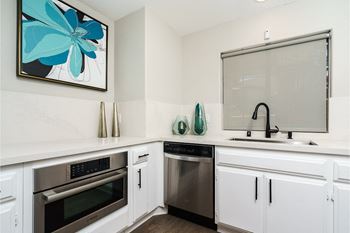 a kitchen with white cabinets and stainless steel appliances at Westlake Canyon, Thousand Oaks, CA 91362